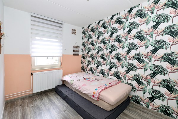 Foto - Te koop: Een goed geïsoleerde tussenwoning met onder meer een zonnige tuin op het zuiden, 3 slaapkamers, fijne badkamer, grote zolder(slaap)kamer, rustige tuin en een garage in Voerendaal.(Kunrade)